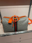 Sac de voyage GG Supreme beige et orange avec bande Web
