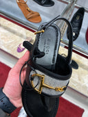 Sandales plates Horsebit en cuir noir et toile tressée