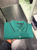 Polo en piqué de coton vert émeraude à finitions contrastées