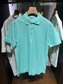 Polo piqué à détail check turquoise pastel