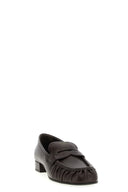 Mocassins à bout recourbé