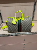 Sac de voyage GG Supreme beige et jaune fluo avec bande Web