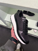 Sneakers en cuir et nylon noir à semelle oversize contrastante