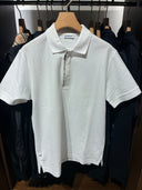 Polo piqué zippé en coton avec détail Check signature