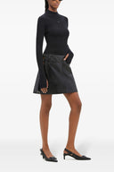 Mini-jupe en vinyle multi-sangles