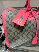Sac de voyage monogrammé dégradé rose fluo
