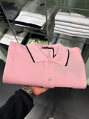 Polo en piqué de coton rose pâle à finitions contrastées