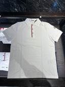 Polo piqué blanc à patte de boutonnage tricolore
