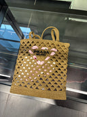 Sac cabas en raphia tressé à motif floral