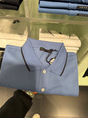 Polo en piqué de coton bleu ciel à finitions contrastées