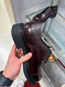 Souliers Derby en cuir à motif GG embossé et semelle commando