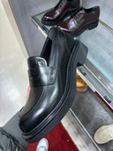 Mocassins plateforme en cuir noir GG embossé