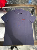 Polo piqué bleu marine à logo poisson brodé