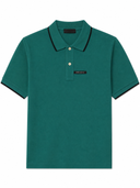 Polo en piqué de coton vert émeraude à finitions contrastées