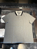 Polo piqué gris chiné à col contrasté noir et blanc