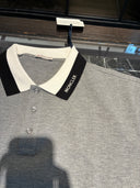 Polo piqué gris chiné à col contrasté noir et blanc