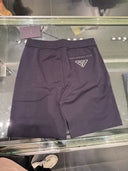 Short en molleton bleu marine avec détail nylon et logo triangle