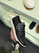 Sneakers basses en cuir noir et blanc