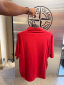 Polo zippé en maille rouge corail