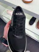 Sneakers basses en cuir noir et blanc