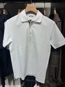 Polo piqué à patte de boutonnage check blanc
