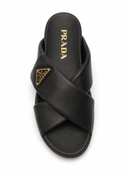 Mules plates croisées en cuir noires
